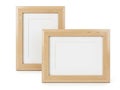 Two wooden frames with white mats displayed against a white background Royalty Free Stock Photo