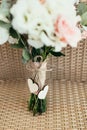 Two wooden hearts with bow on wedding bouquet Royalty Free Stock Photo