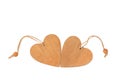 Two wooden hearts lie side by side isolated on a white background. Royalty Free Stock Photo