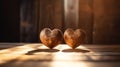 Two wooden hearts on rustic table with sunlight, abstract, love