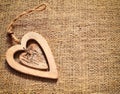 Two wooden hearts on sackcloth, canvas background. Vintage style. Royalty Free Stock Photo