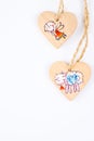 Two wooden hearts on string forming Christmas pattern Royalty Free Stock Photo