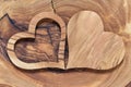 Two wooden hearts on a wooden background Royalty Free Stock Photo