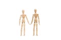 Two wooden manequin toy as if they were holding hands