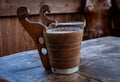 Two wooden mugs with fermented sheep milk on the table. Royalty Free Stock Photo