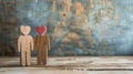 Two Wooden People Standing Together Royalty Free Stock Photo