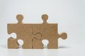 Two Wooden pieces of jigsaw puzzle with white background and selelective focus Royalty Free Stock Photo