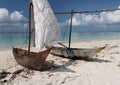 Two wooden sailing boats on tropical beach Royalty Free Stock Photo