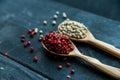 Two wooden spoons with pink and white peppercorn Royalty Free Stock Photo