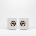 Two wooden white speakers with golden speaker driver Royalty Free Stock Photo