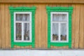 Two wooden windows on the old wall Royalty Free Stock Photo