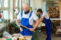 Two worker in a carpenter's workshop Royalty Free Stock Photo