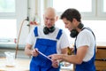 Two worker in a carpenter's workshop Royalty Free Stock Photo