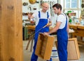 Two worker in a carpenter's workshop Royalty Free Stock Photo