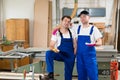 Two worker in a carpenter's workshop Royalty Free Stock Photo