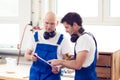 Two worker in a carpenter's workshop Royalty Free Stock Photo