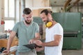 Two worker in a carpenter`s workshop Royalty Free Stock Photo