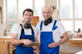 Two worker in a carpenter's workshop Royalty Free Stock Photo