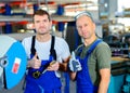 Two worker in factory with thumb up