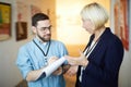 Two Workers in Art Gallery Royalty Free Stock Photo