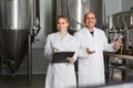 Two workers on brewery factory Royalty Free Stock Photo