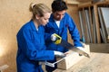 Two workers in carpentry workshop Royalty Free Stock Photo