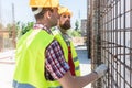 Two workers checking the durability of the steel structure Royalty Free Stock Photo