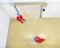 Two workers cleaning floor in industrial building Royalty Free Stock Photo