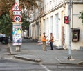 Two workers communicate on the street