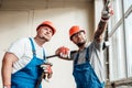 Two workers at a construction site, discussing forthcoming work Royalty Free Stock Photo