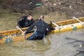 Two workers install concrete form work