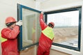 Two workers installing window Royalty Free Stock Photo