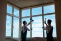 Two workers installing a window Royalty Free Stock Photo