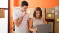 Two workers man and woman using laptop working at office Royalty Free Stock Photo