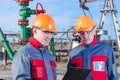 Two workers in the oilfield Royalty Free Stock Photo