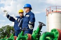 Two workers in the oilfield. Oil and gas concept Royalty Free Stock Photo
