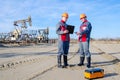 Two workers in the oilfield Royalty Free Stock Photo