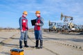 Two workers in the oilfield Royalty Free Stock Photo