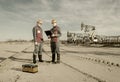 Two workers in the oilfield Royalty Free Stock Photo