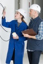 two workers renovating kitchen