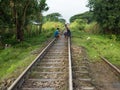 Way to Kay Tiyo, two men resting at work on the train track, Myanmar