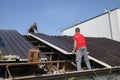 Two workers roofer builder working on roof structure on construction site Royalty Free Stock Photo