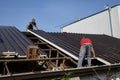 Two workers roofer builder working on roof structure on construction site Royalty Free Stock Photo