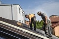 Two workers roofer builder working on roof structure on construction site Royalty Free Stock Photo