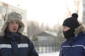 Two workers at the site of the ice camp