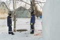 Two workers at the site of the ice camp