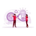 Two workers stand exchanging ideas about the future economy. Circular economy icon behind it. Circular Economy concept. Royalty Free Stock Photo