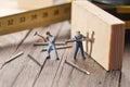 Two workers sticks nail. The concept of teamwork Royalty Free Stock Photo
