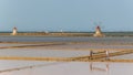 Two workers at the west coast salt pans in Marsala