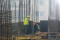 Two labours work on reinforcement bar at the construction site Royalty Free Stock Photo